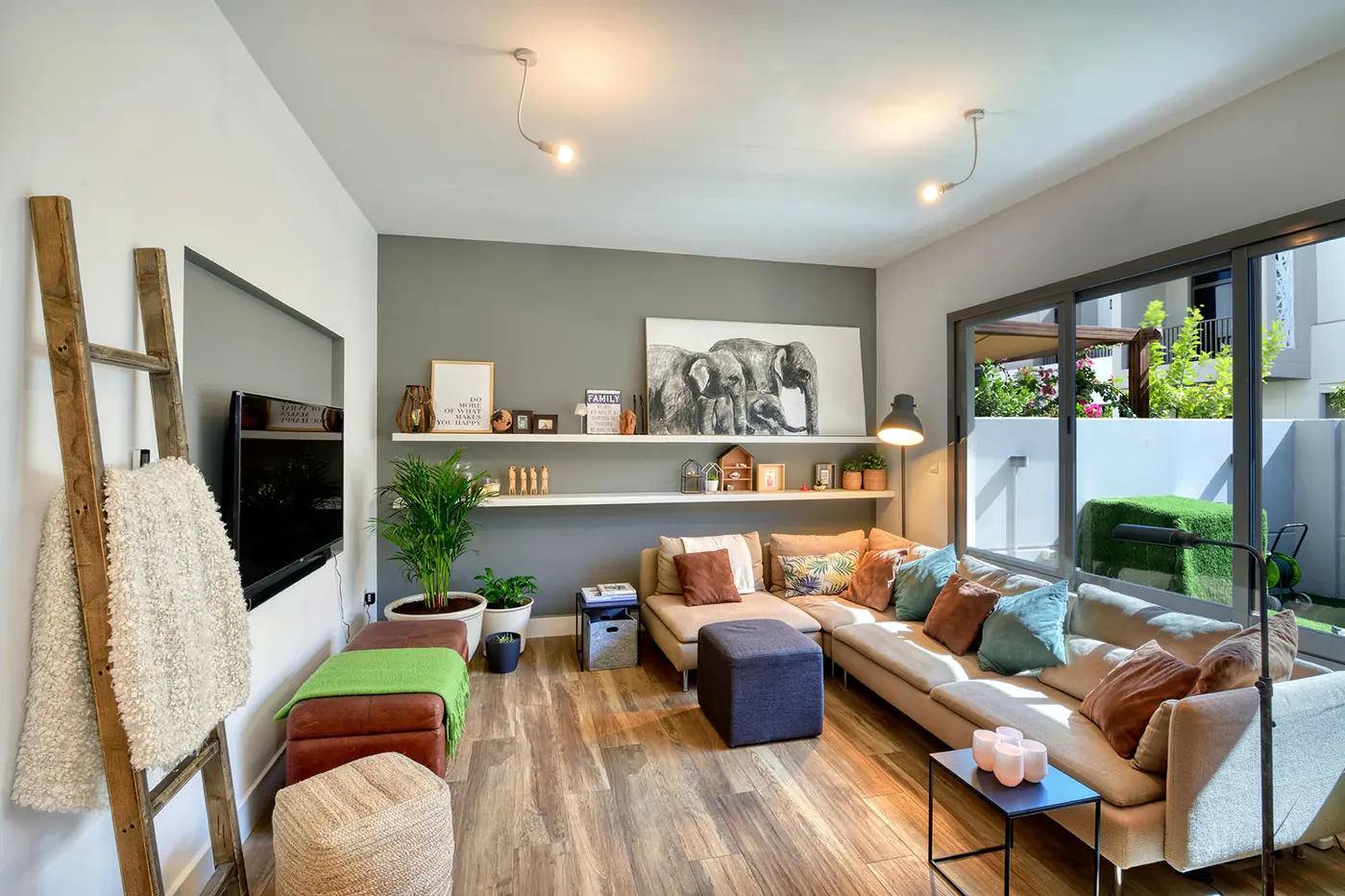 Residential living room interior styled with natural wood flooring