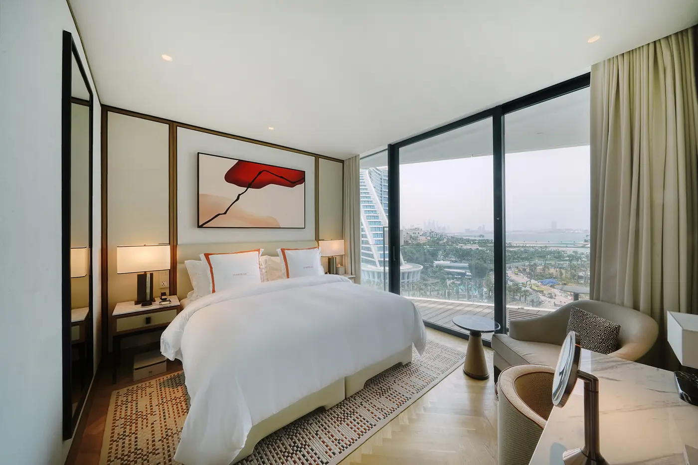 Luxury hotel bedroom interior with statement artwork above the headboard