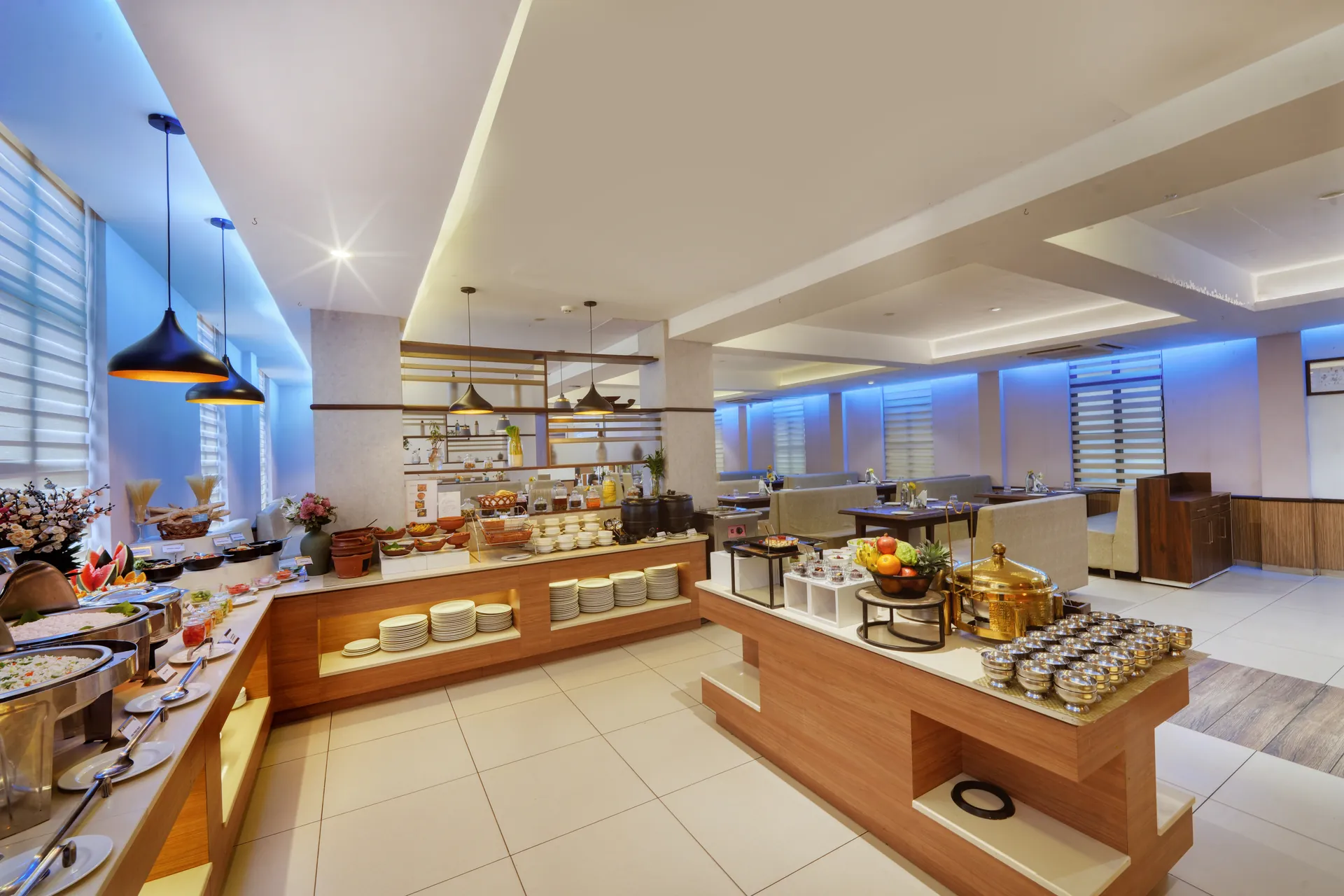 Hotel breakfast buffet spread with chafing dishes, fruit bowl and serving stations — hotel properties shot in Kochi, Kerala, Bengaluru (Bangalore)