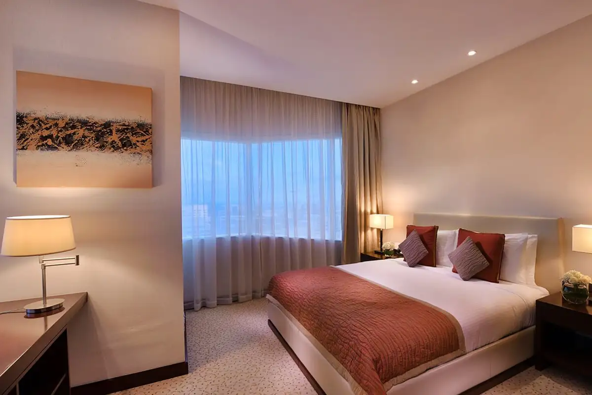 Hotel bedroom interior photography with warm accent lighting by Goa Interior photographer.