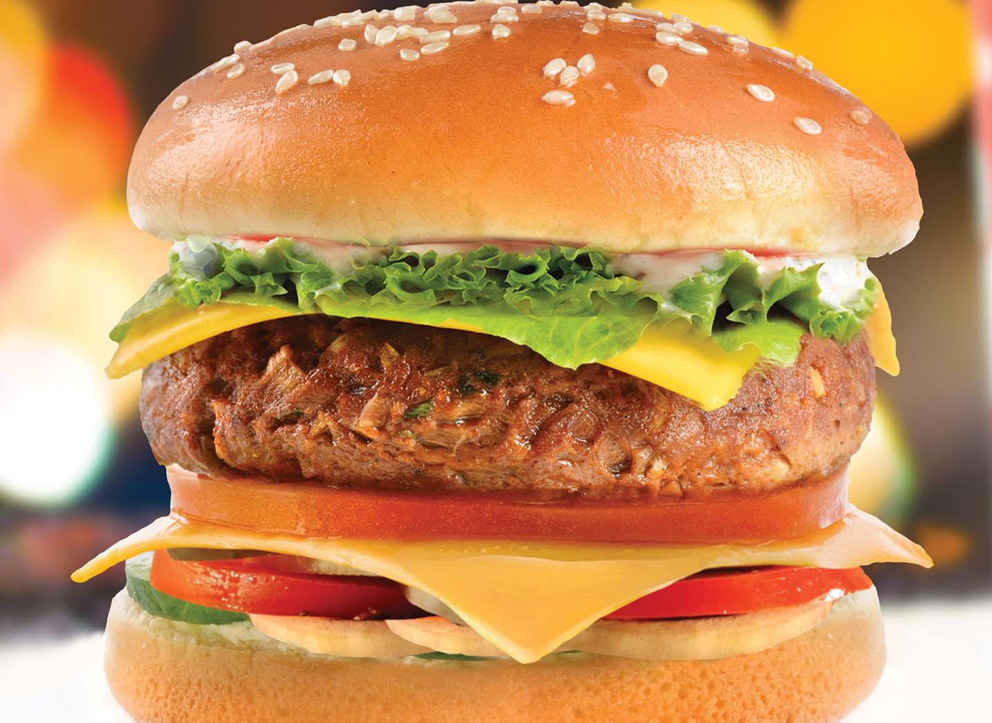 Gourmet cheeseburger with cheddar, lettuce and tomato, resort dining